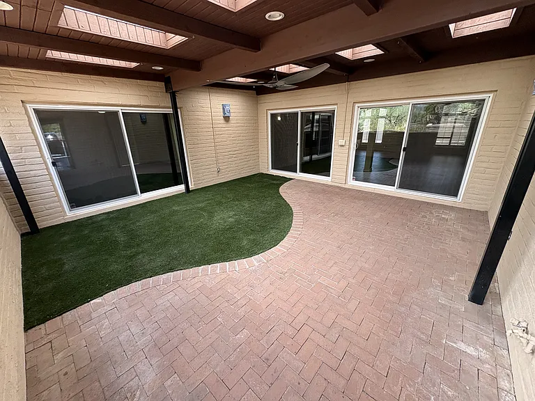 Covered patio off of living room and master bedroom