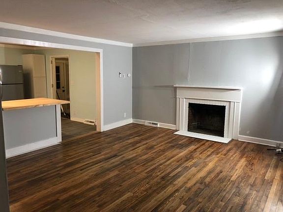 Living room with open kitchen counter bar
