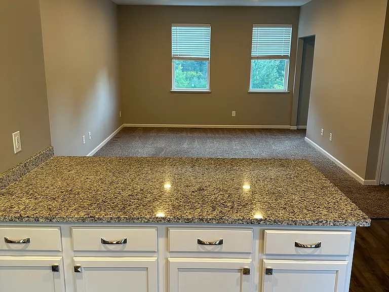 Nice storage in the island and perfect for 3 stools on side facing family room.