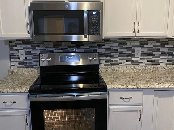 New back splash, new range and microwave.