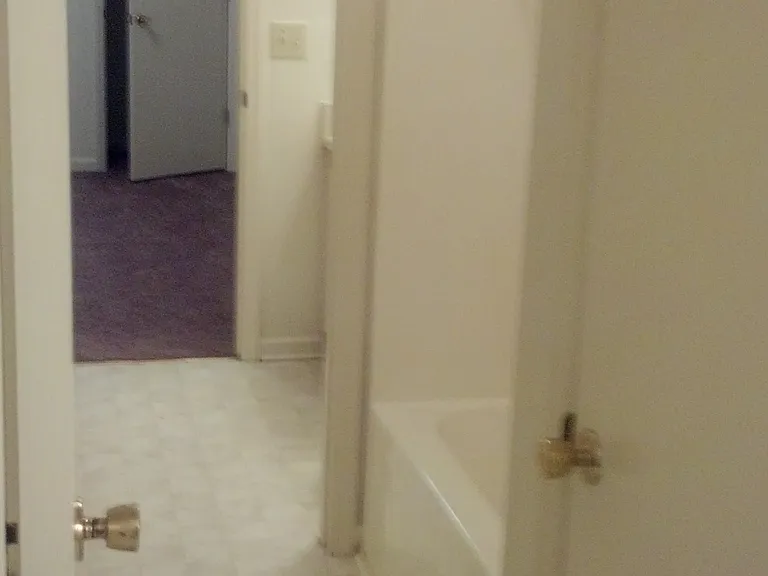 jack and jill bathroom between the bedrooms, 2 private sink/toilet areas, one tub/shower area in the middler