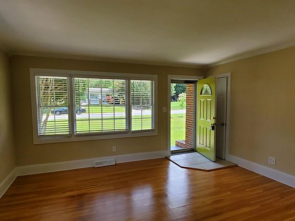 Spacious Living Room with Hardwood Floors throughout main hallway and Bedrooms.