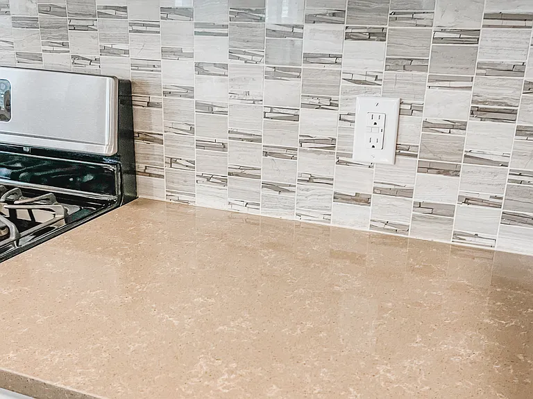Kitchen tile backsplash. Currently has removable wallpaper