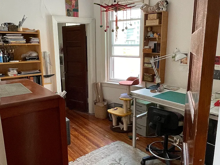 middle bedroom with current tenant's furnishings
