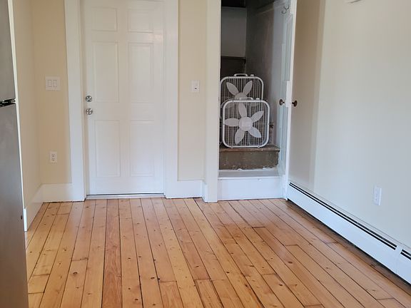 Stairs to walk up to attic has a lot of storage space