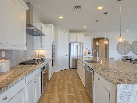 Large corner pantry in the kitchen in addition to the cabinets provide lots of storage for kitchen a