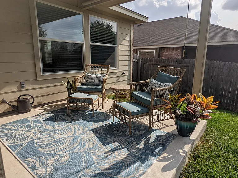 Outdoor patio with sunshade. Large yard space