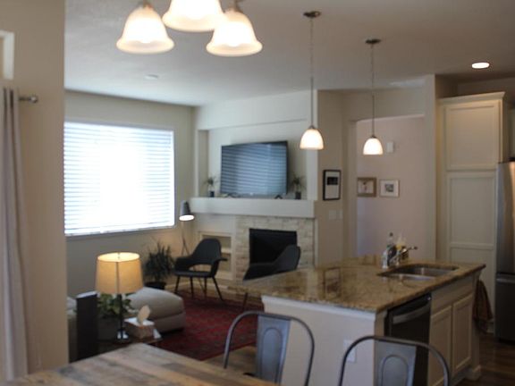 family room with the adjoining kitchen