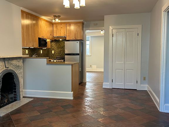 Main room with remote-controlled gas marble fireplace, large closet.