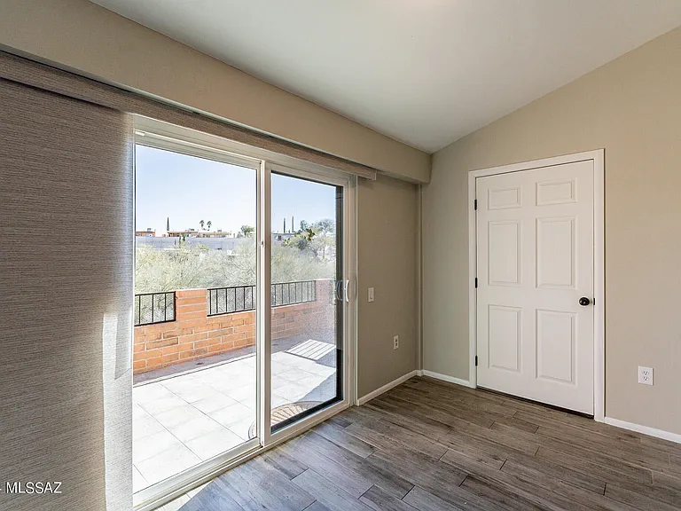 Slider to outside patio and door to laundry and storage area