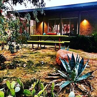 front porch with picnic table outside