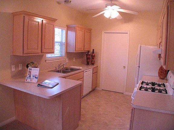 Kitchen with high ceiling & ceiling fan