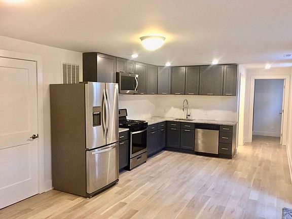 New kitchen with stainless steel appliances, dishwasher, gas range, and optional movable island (not pictured)