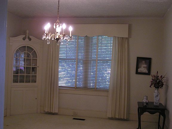 Dining room with charming corner cabinet