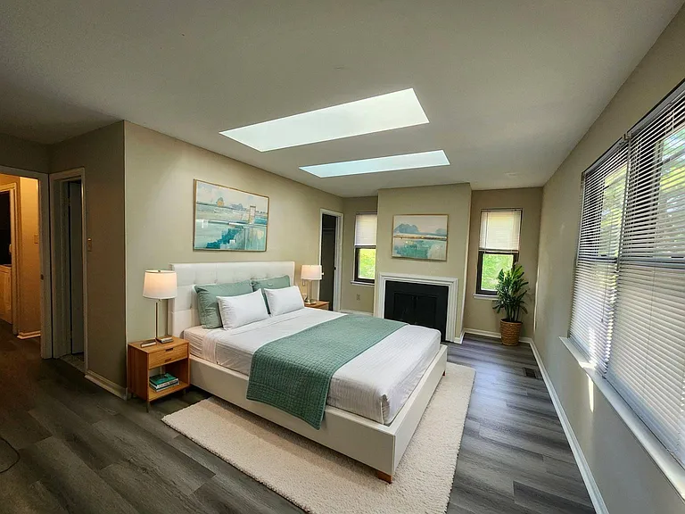 Primary Bedroom has full wall of closets plus large walk-in closet and 2 skylights