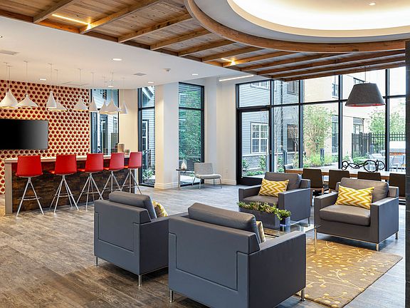 The Entertainment Lounge features bar seating and large-screen TV