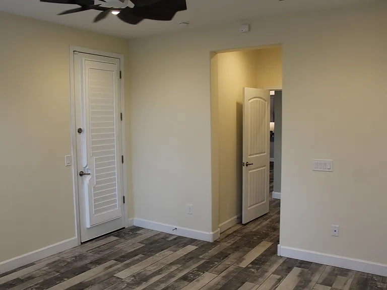 Master bedroom with access to patio. Planation shutters throughout the house