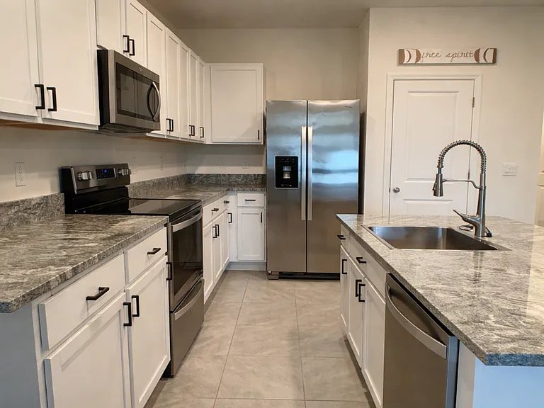 Upgraded sink, soft close cabinets, and cabinet handles