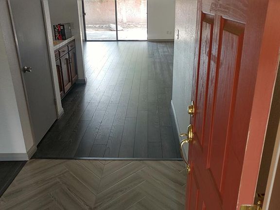 Front entry, showing family room area, Coat closet on left