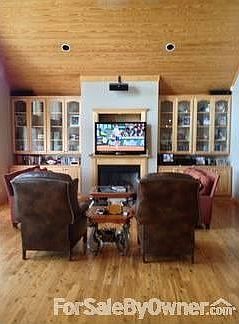 Driveway view of garage and house