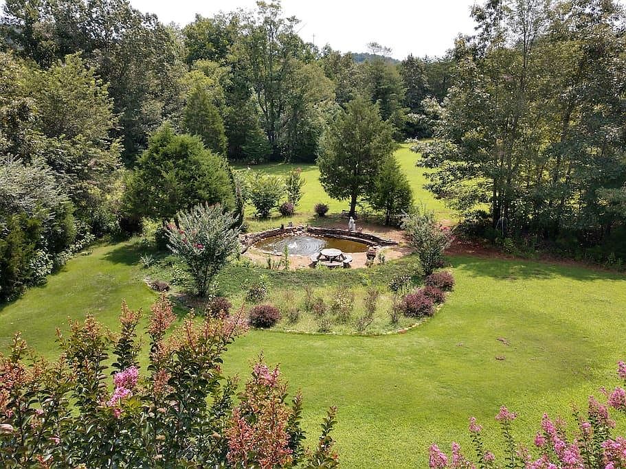 View of back yard from upstairs deck.