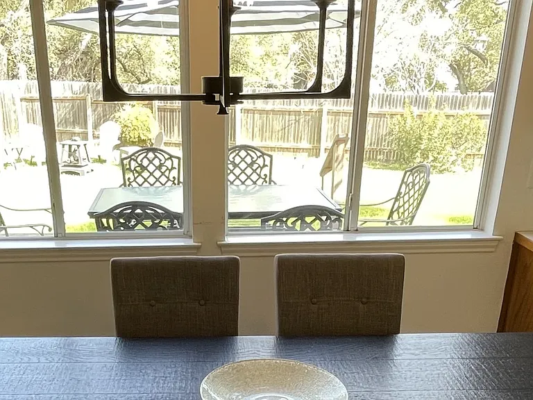 Breakfast area dining space looks out to backyard