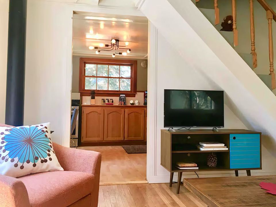 Living room view to kitchen and staircase