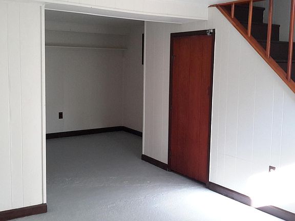 Back half of big room, bed or living area.