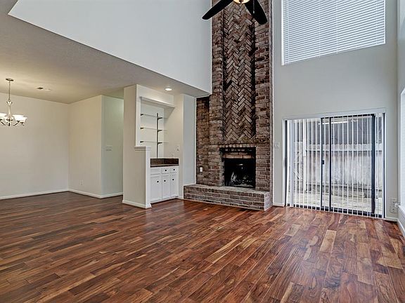 This open and bright living and dining room. Which offers a wet bar for entertaining your guest and access to the patio so you can enjoy the nice weather.