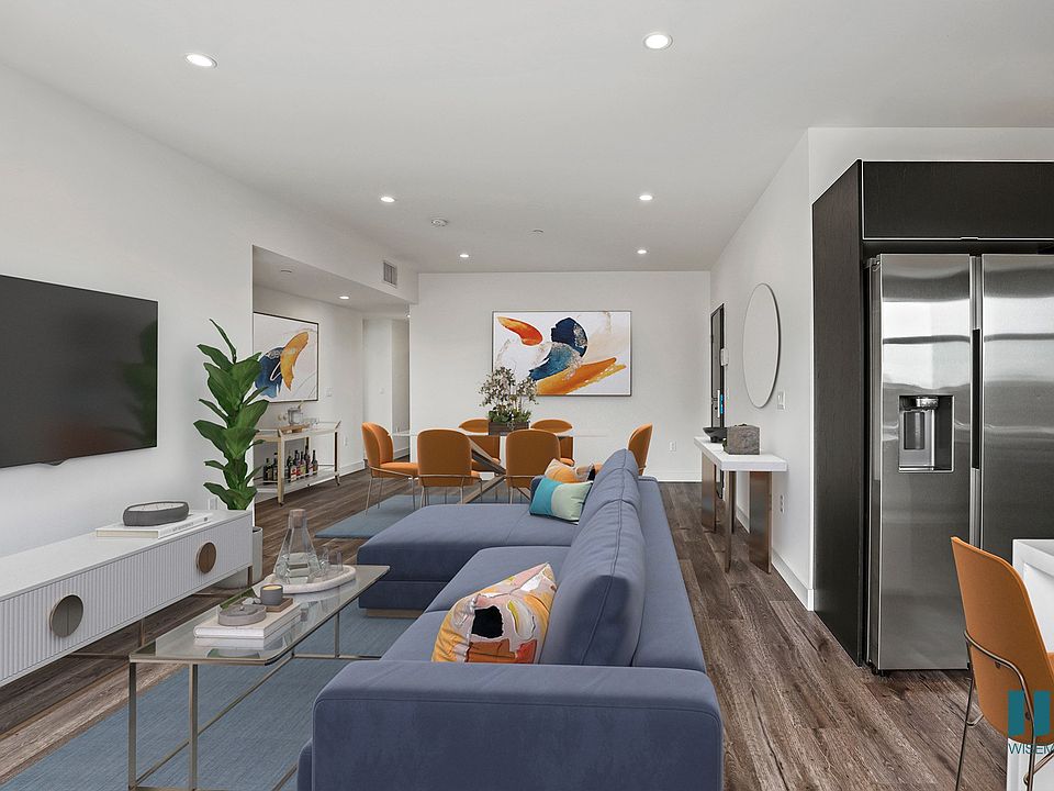 Open-Concept Kitchen, Dining, and Living Room with Vialy Flooring and Recessed Lighting
