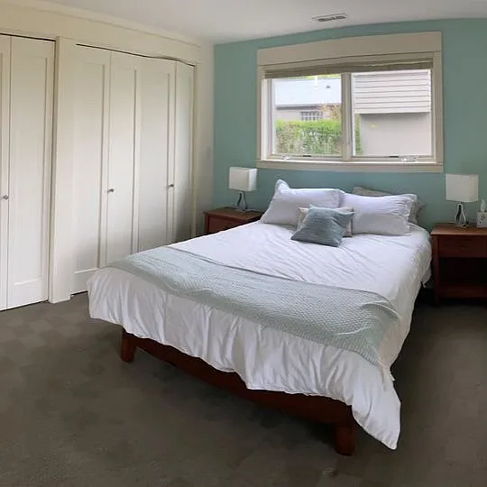 Downstairs bedroom. walks out to deck with views.