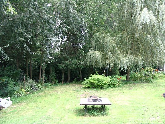 HUGE Back Yard with multi level deck that backs up to above ground pool.