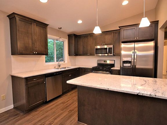Remarkable Kitchen with New Custom Cabinets, Stainless Steele Appliances, Granite Counter tops, Breakfast Bar, Tile Backsplash & recessed lighting