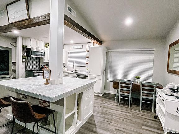 Island Kitchen with brand new appliances and open lighting. Full Access to Dryer and Washing machine