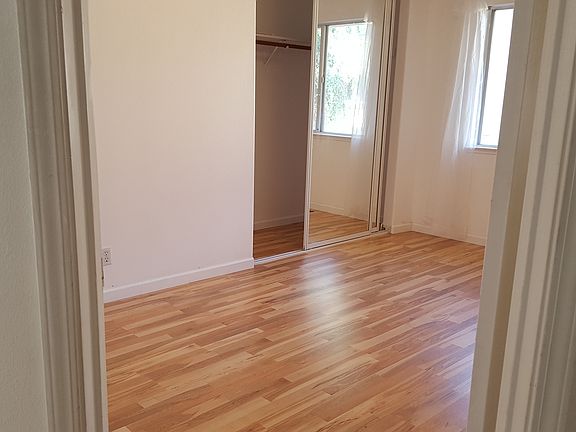 Bright bedroom window opening to the court yard away from street