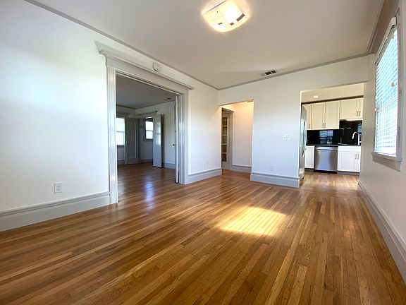 Living Room looking South. Bedroom and Kitchen are visible