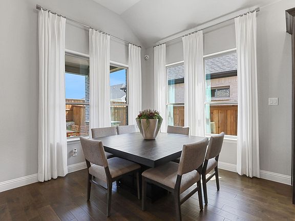 Dining room in the Allure home plan by Trophy Signature Homes - REPRESENTATIVE PHOTO
