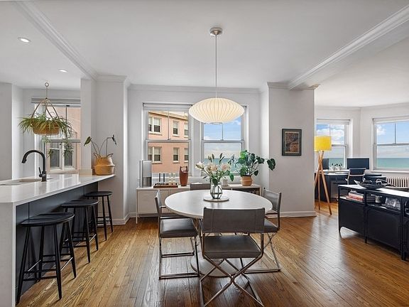 Dining room with kitchen to the left and living ro