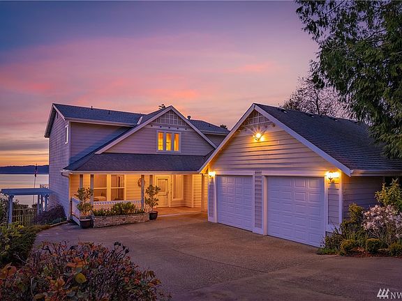 Exceptional Elegant Custom Waterfront Home with Breathtaking Views of the Puget Sound, Olympic Mountains, and Colorful Sunsets.