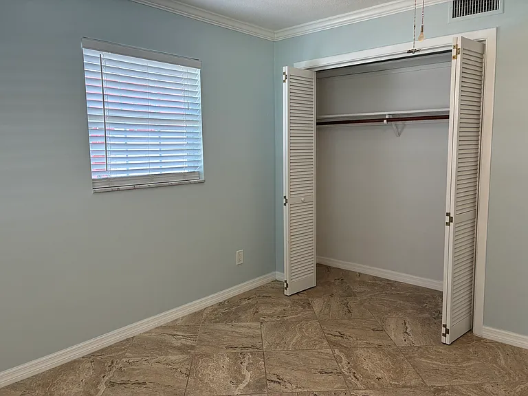 secondary bedroom with closet