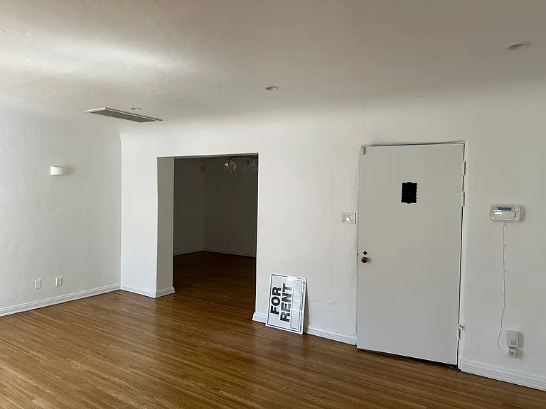 View of front door and entry to formal dining room