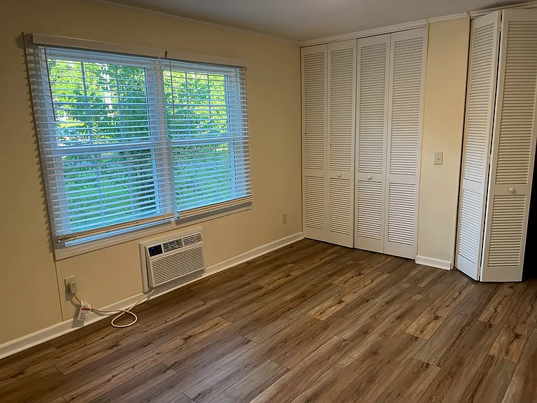 In the bedroom is an in-the-wall heating and air conditioning unit sufficient for the one bedroom apartment.