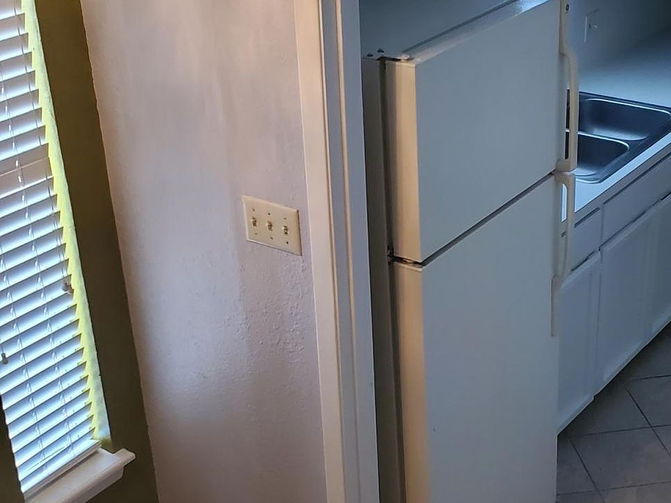 Coming down stairs view into kitchen entryway