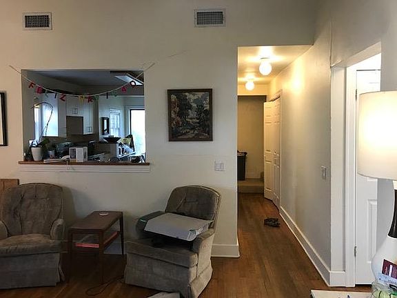 Hallway view leading to the master bedroom and office. 2 front bedrooms, full bath, linen closet and a coat closet on the right.