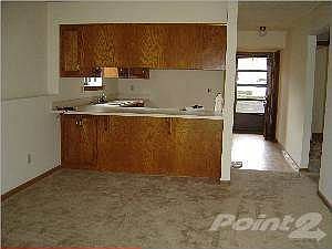 VIEW OF KITCHEN FROM LIVING ROOM