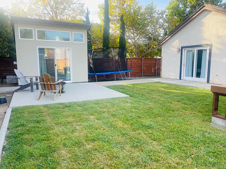 Backyard with view of office and primary bedroom