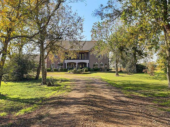 Another view of the front of your new home looking through the old growth trees.
