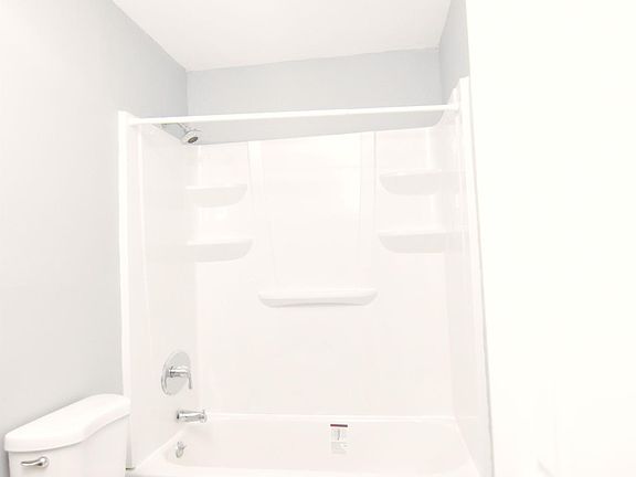 Full bathroom with tiled flooring