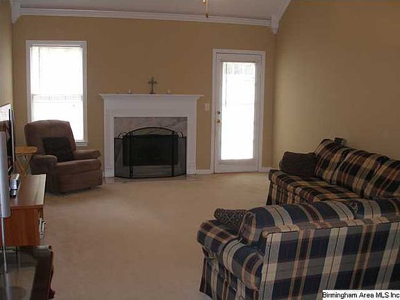 Spacious family room has vaulted ceiling and fireplace