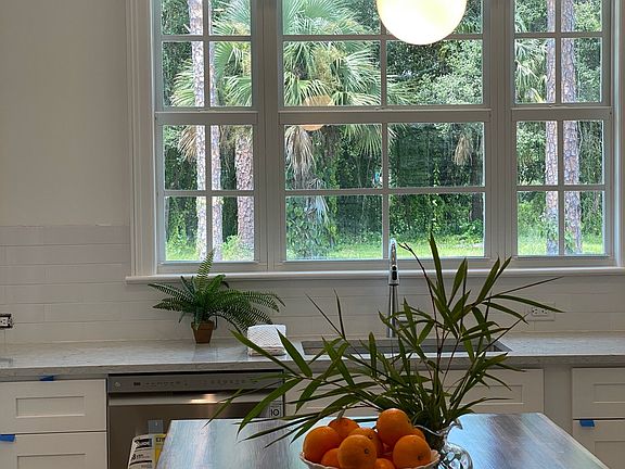 Kitchen with back yard view (looks out to pool as well)